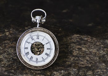 Round Gray Pocket Watch Reading 1:56 Time