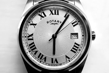Round Gray Rotary Analog Watch 6:06 Display