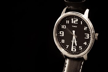 Round Silver-colored Timex Analog Watch With Black Band Displaying 5:29 Time