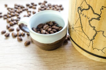 Round White and Brown Mug With Coffee Beans