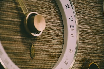 Round White and Gray Lens on Brown Textile