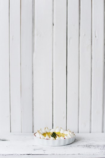 Round White Bowl of Foods on White Wooden Panel