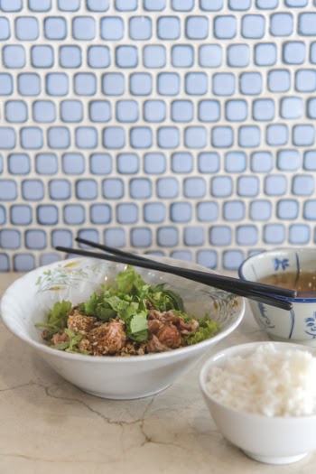 Round White Ceramic Bowl With Ground Meat and Vegetables and Chopsticks on Top