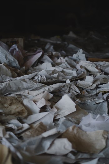 Ruined papers strewn across the destroyed office of Rashid Bank in Shingal, following war with the Islamic State.