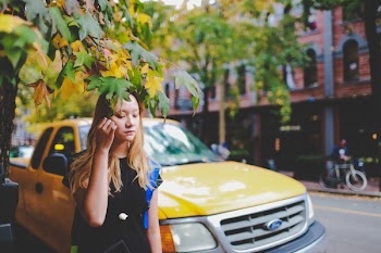 Rule of Thirds Photography of Girl Holding Tree Leaves