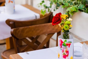 Rule of Thirds Photography of Yellow and Red Flowers in Glass Vase