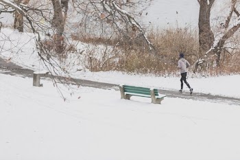 Runner In Snow Park