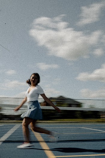 Running Woman on Tennis Field