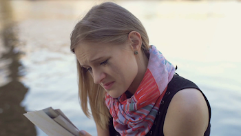 Sad girl crying while reading love letter next to the river Stock ...