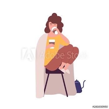 Sad sleepy young woman drinking coffee