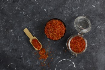 Saffron spice herb in wooden spoon Free Photo