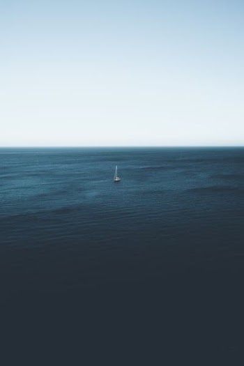 sailboat on body of water during daytime
