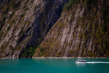 Sailboat on Ocean Near Mountain