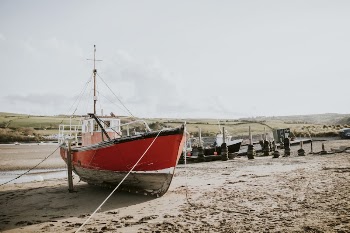 Sailboat stranded on a beach | Free Photo - rawpixel