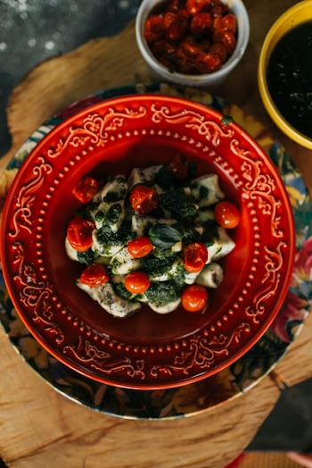 Salad on Round Red Plate Close-up Photo