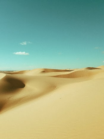 Sand Dunes Under Blue Sky