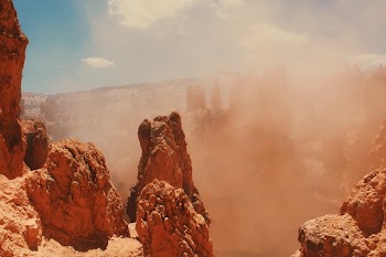 Sand Storm And Rock Formation