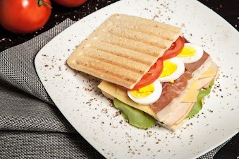 sandwich on top white plate