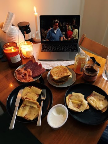 Sandwiches and Watching a Show on a Laptop
