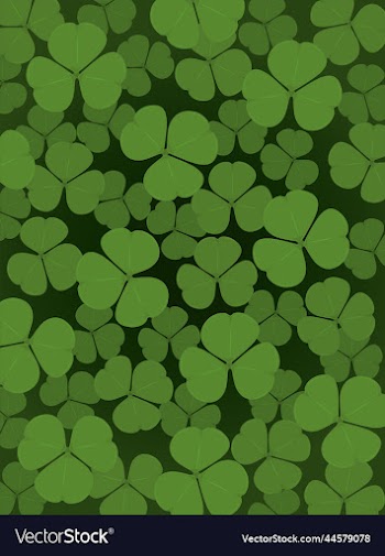 saturated green clover leaves vertical background