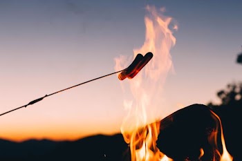 sausage cooking on fire