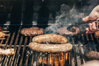 Sausages And Burgers On A Grill
