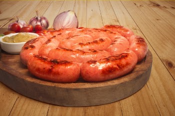 Sausages on Top of Brown Wooden Board