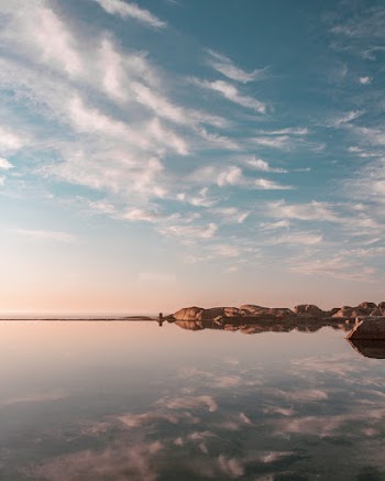 Scenic Photo of Bay Under Blue Sky
