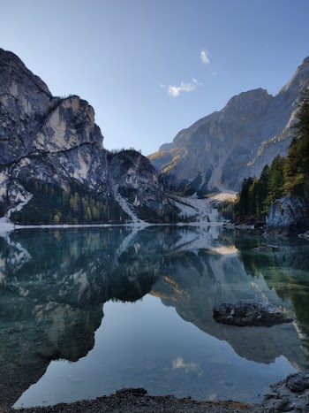 Scenic Photo of Lake Across Mountains