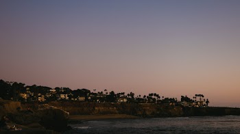 Scenic Photo Of Seashore During Dawn