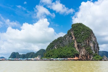 Scenic View of an Island Against Cloudy Sky
