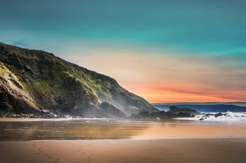 Scenic View of Beach During Dawn