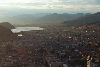 Scenic View Of City Near Mountains