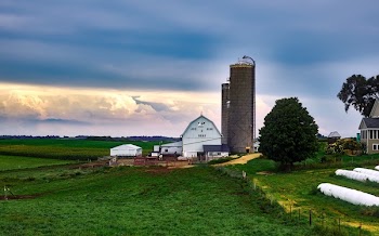Scenic View of Landscape Against Cloudy Sky