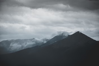 Scenic View of Mountain Under Cloudy Sky