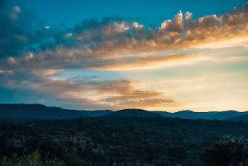 Scenic View Of Mountains During Golden Hour
