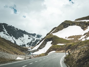 Scenic View of Mountains Under Cloudy Sky