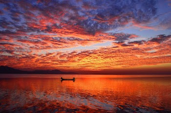 Scenic View Of Ocean During Sunset