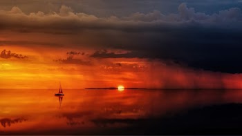 Scenic View Of Ocean During Sunset