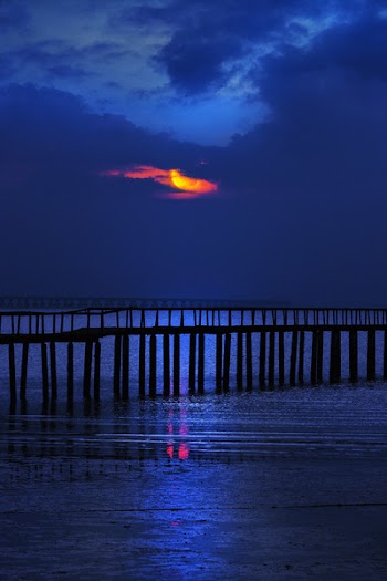 Scenic View Of Ocean During Sunset