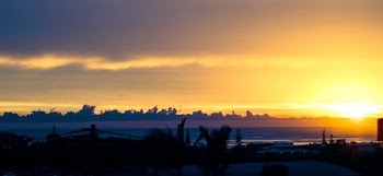Scenic View of Ocean During Sunset