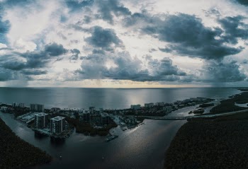 Scenic View of Ocean Under Cloudy Sky