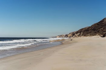 Scenic view of shore of the ocean, background. Nazare, Portugal.