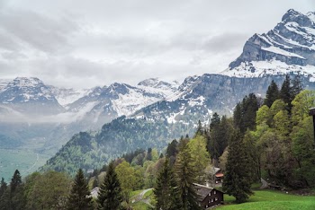 Scenic View Of Snow Capped Mountains