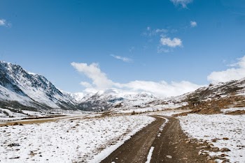 Scenic View Of Snow Capped Mountains During Daytime