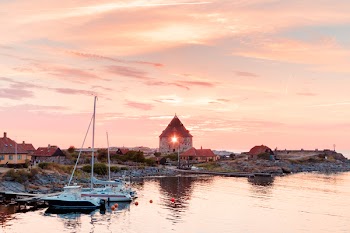 Scenic View of Town Near Ocean During Dawn
