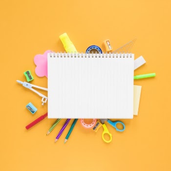 School and office stuff on amber background Free Photo