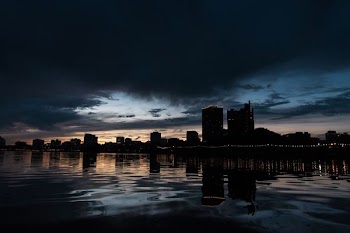 scnery of buildings near body of water