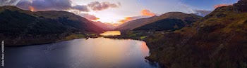 Scottish beautiful colorful sunset landscape with Loch Voil, mountains and forest at Loch Lomond & The Trossachs National Park