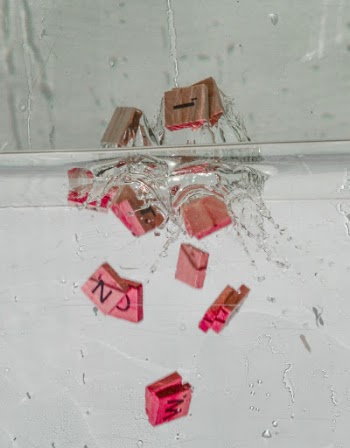 Scrabble Pieces In The Water